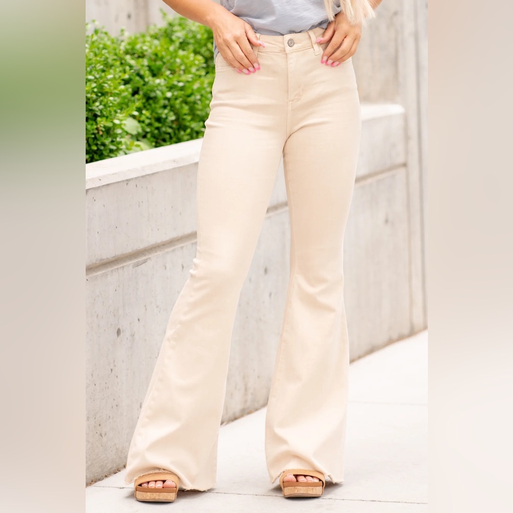 Cream flare jeans